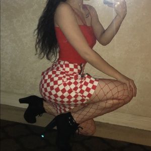 Red top, checkered skirt, fishnet leggings!